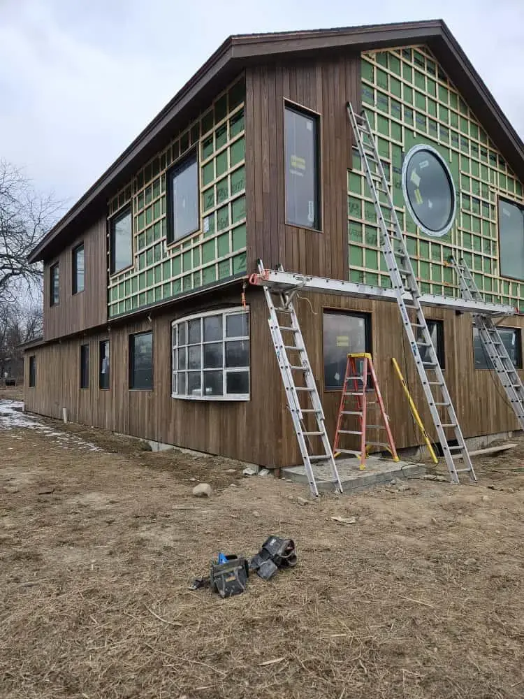 Vinyl siding installation on a New York residential exterior