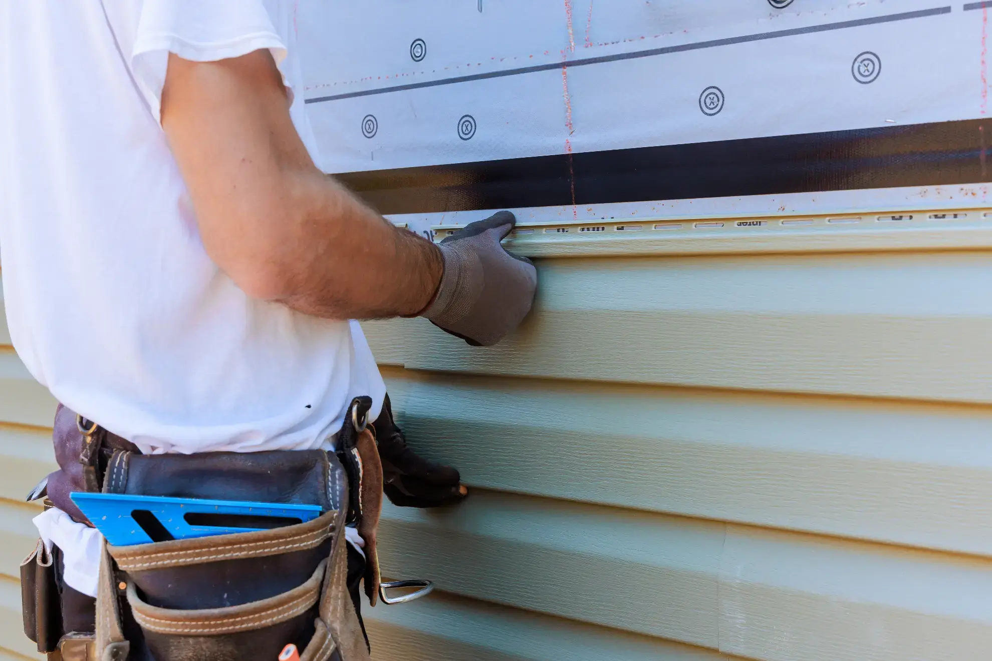Siding installation in progress on a house